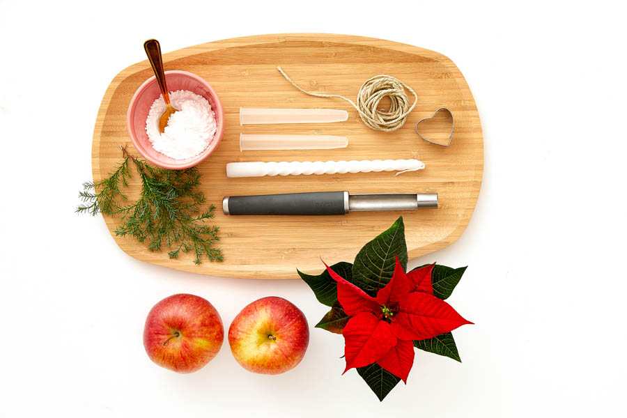 Dekoration mit dem Weihnachtsstern: Apfel als Vase & Kerzenständer